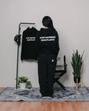 Stop Watering Dead Plants 2.0 Relaxed Black Hoodie